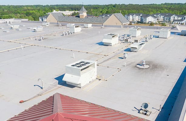 Drone Images of TPO Flat Commercial Roof With Metal Panels: New & Existing Construction
